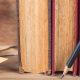 Libros sobre una mesa; el Premio Planeta cumple 75 años como el galardón mejor dotado del mundo para una novela inédita