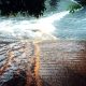 Calle inundada por las lluvias torrenciales de la dana Adam en el litoral mediterráneo